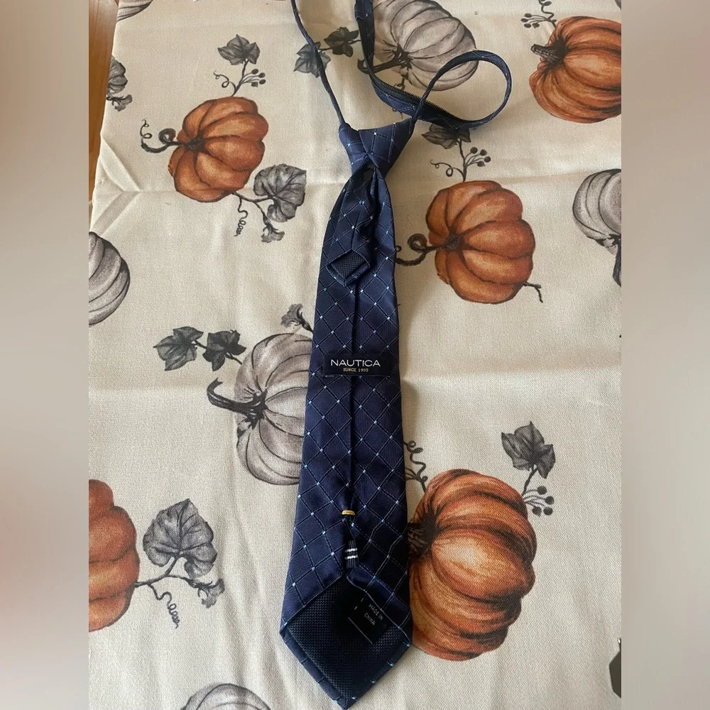 Kids 100% silk Nautica navy tie.